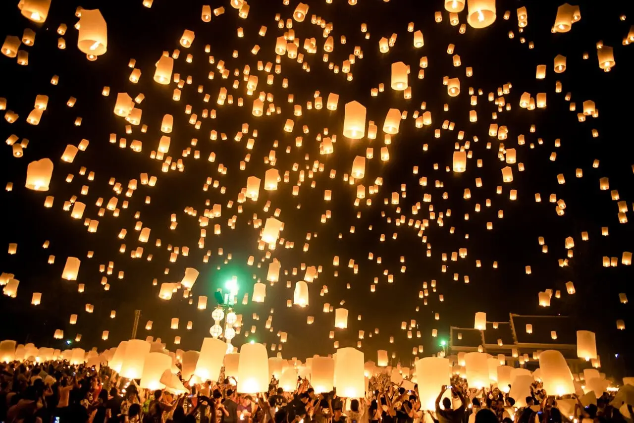 Lanterns filling the night sky at a Chiang Mai lantern release