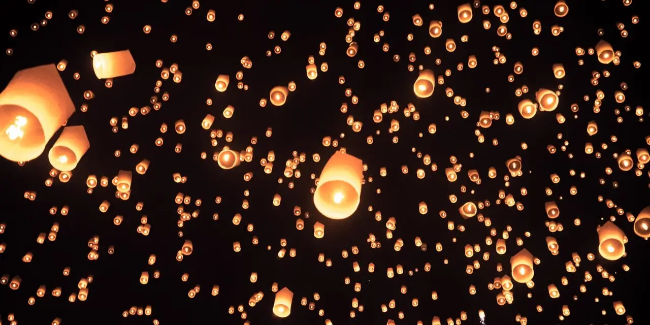 Sky lanterns drifting upwards