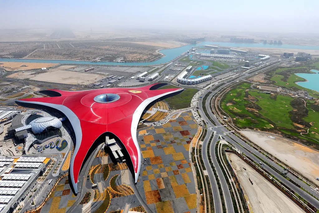 Aerial view of Ferrari World's red roof with the Ferrari logo on Yas Island