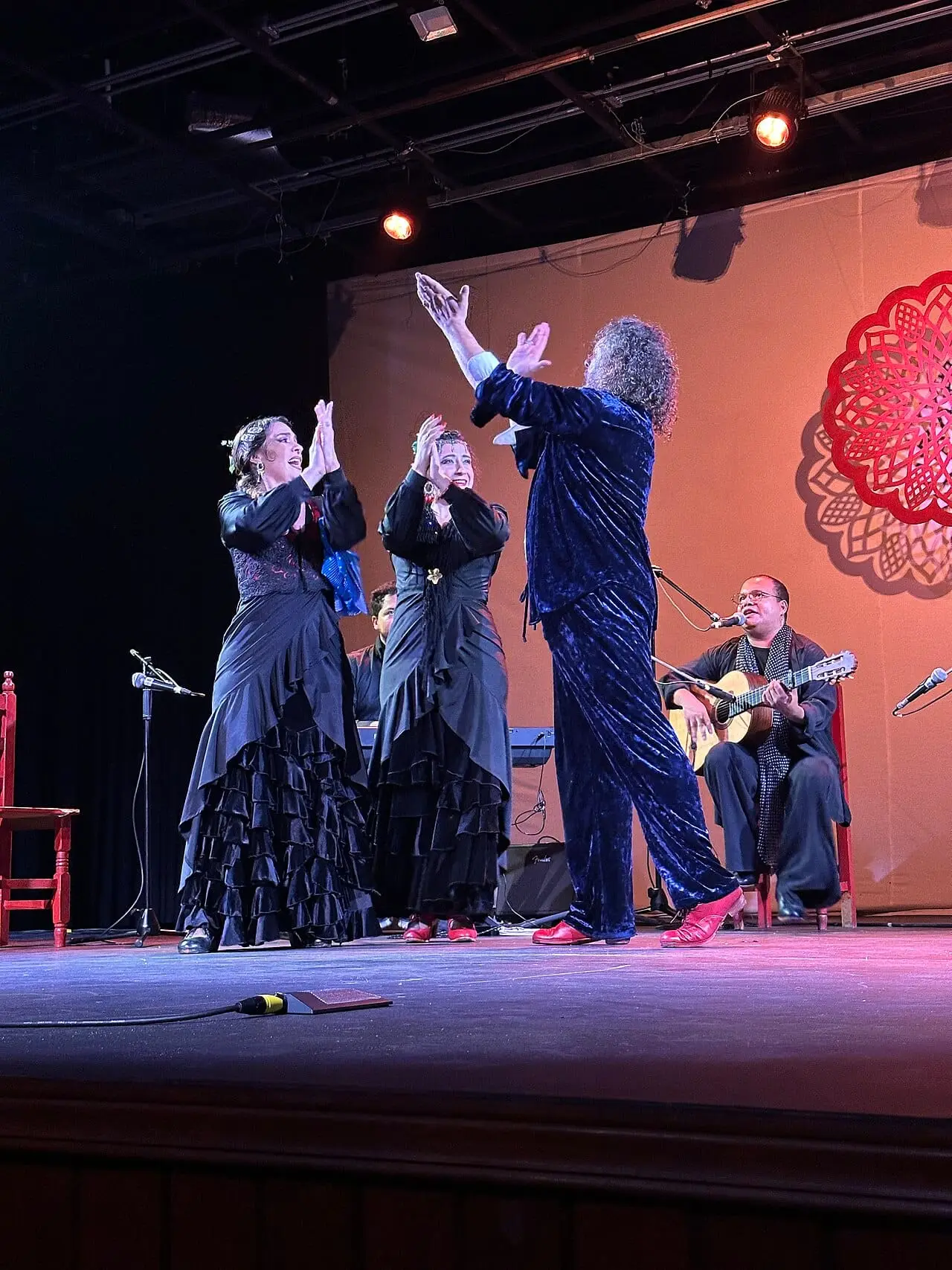 Flamenco dancers and musicians on stage