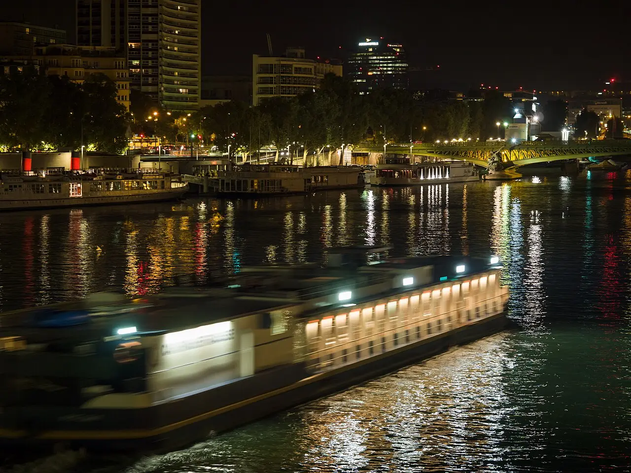 A dinner boat on the Seine at night