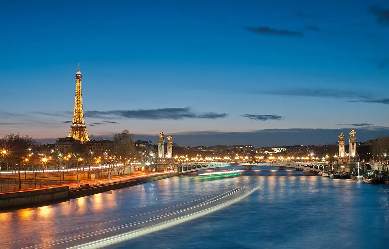 The Eiffel Tower and the Seine at night