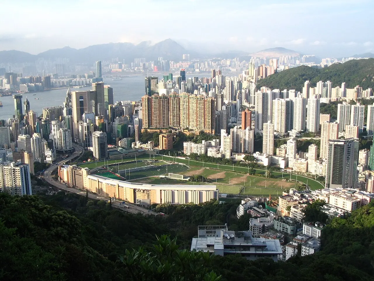 Happy Valley Racecourse surrounded by the towers of Hong Kong Island