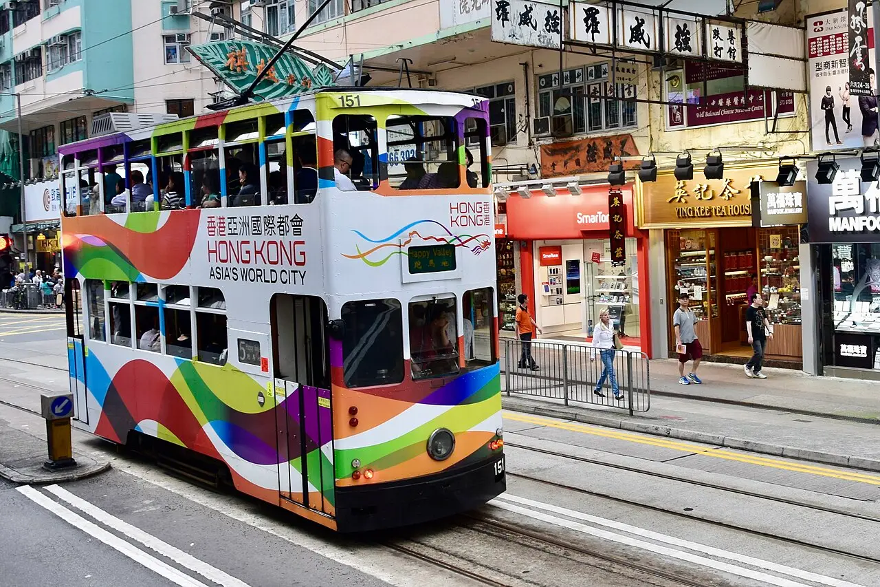A colourful double-decker tram on a Hong Kong street