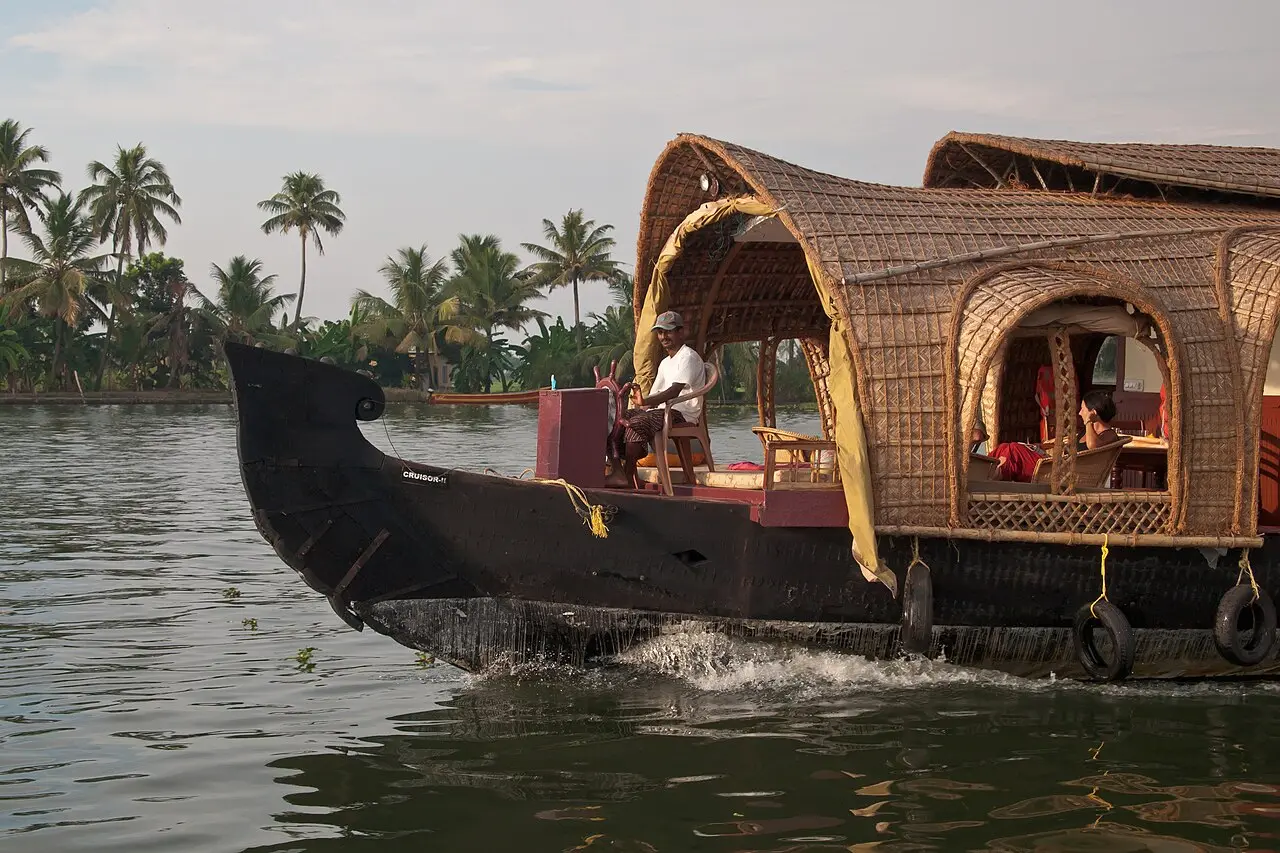 A kettuvallam houseboat cruising the Kerala backwaters