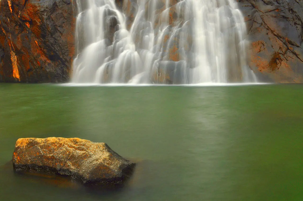 The green pool at the foot of the falls