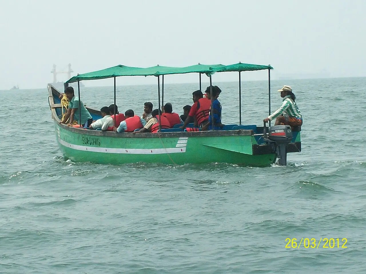 A boatload of visitors heading out on the Arabian Sea