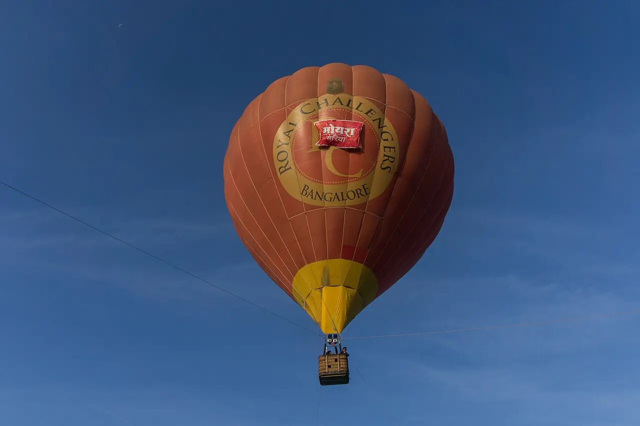 A balloon drifting across a blue sky