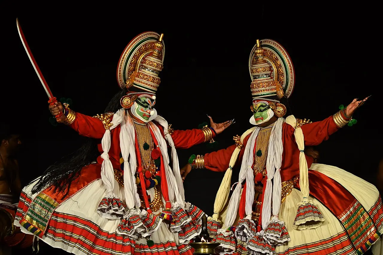 Two Kathakali dancers on stage