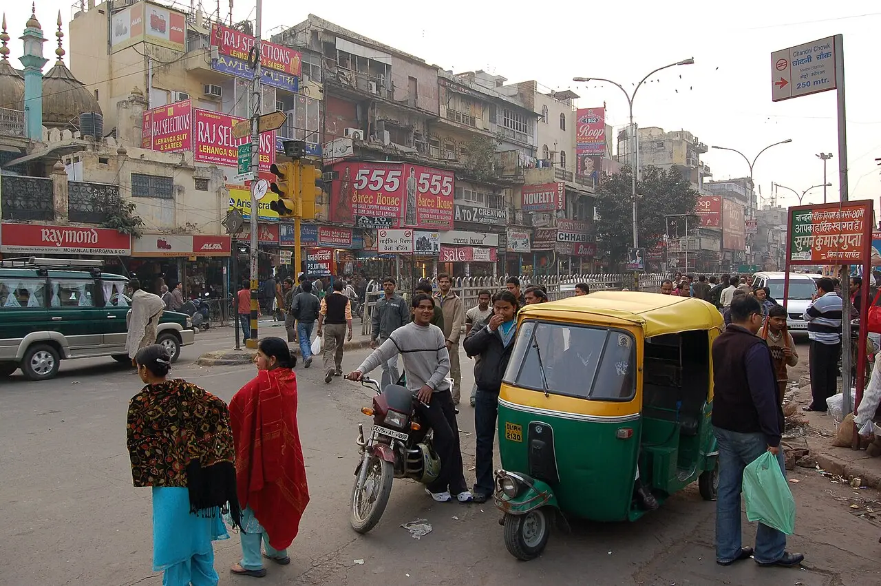 Auto-rickshaws and shoppers in Chandni Chowk