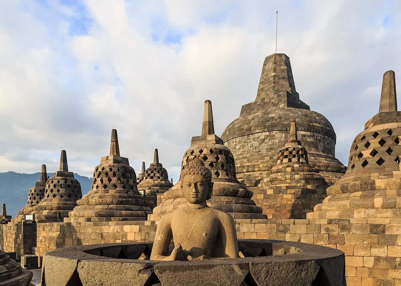 A Buddha statue among the stupas of Borobudur