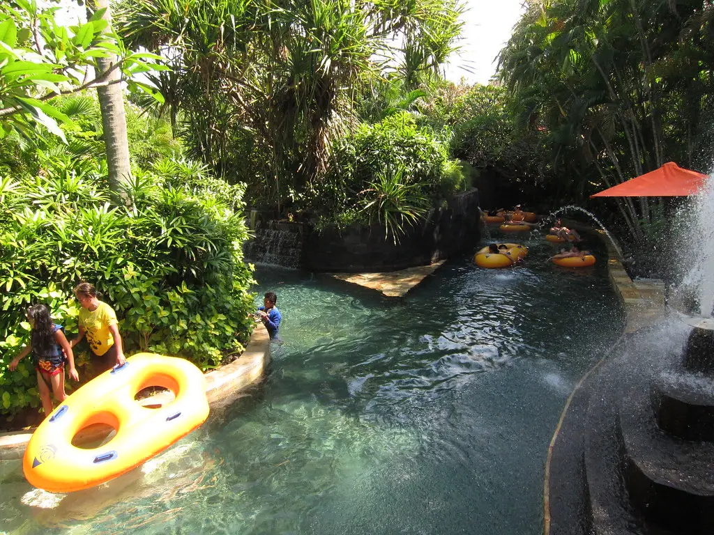 Tubes on the lazy river among tropical gardens
