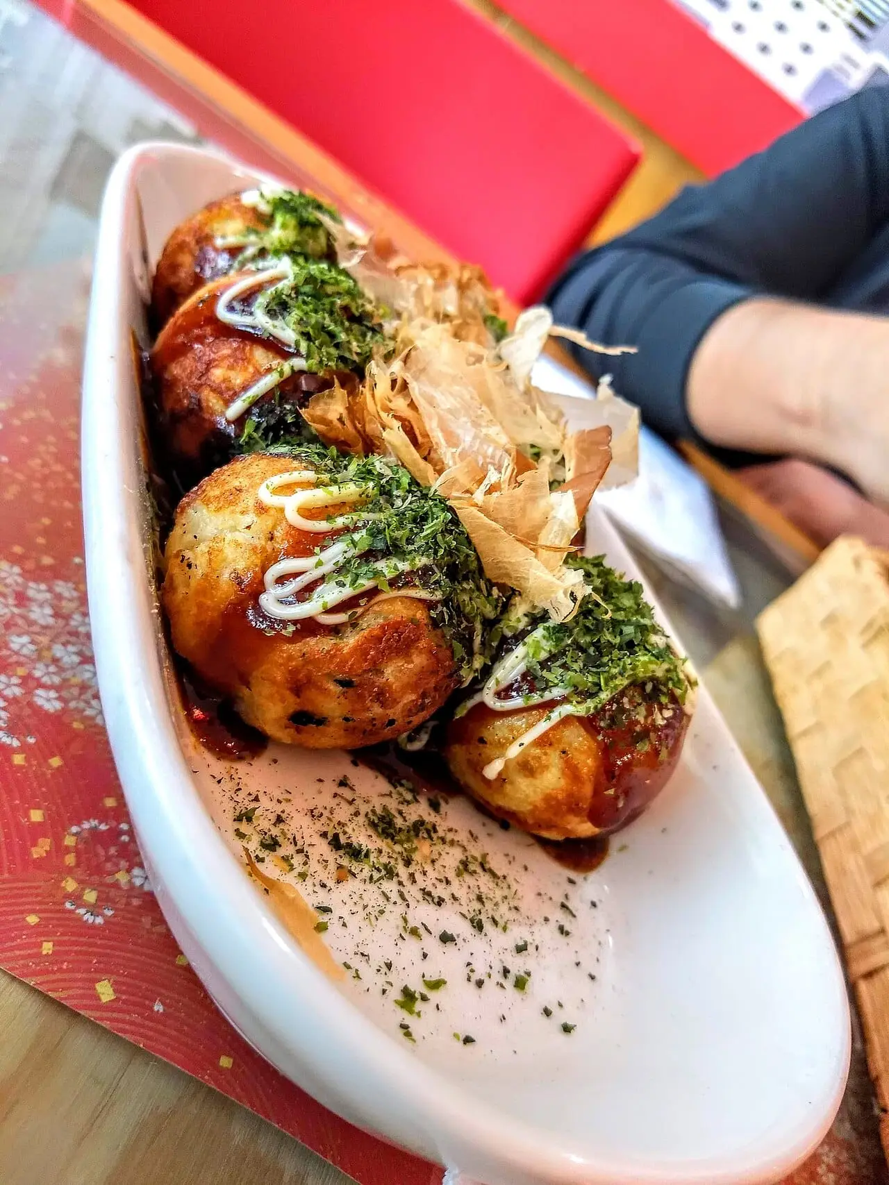 Takoyaki octopus balls with sauce and bonito flakes