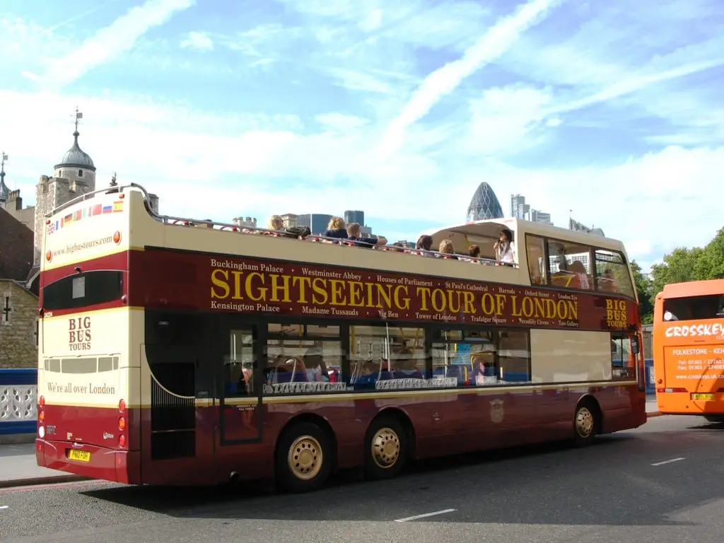 A Big Bus tour passing the Tower of London