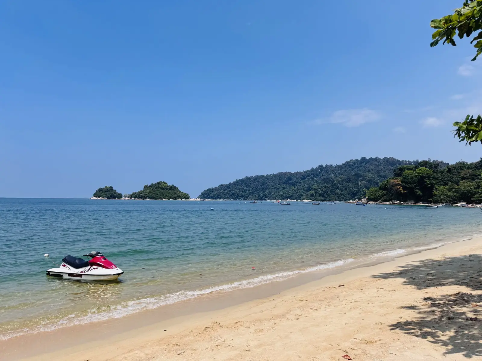 Jet skis on a quiet island beach
