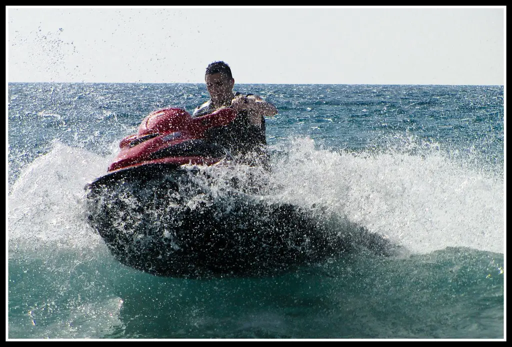 A jet ski splashing through the waves