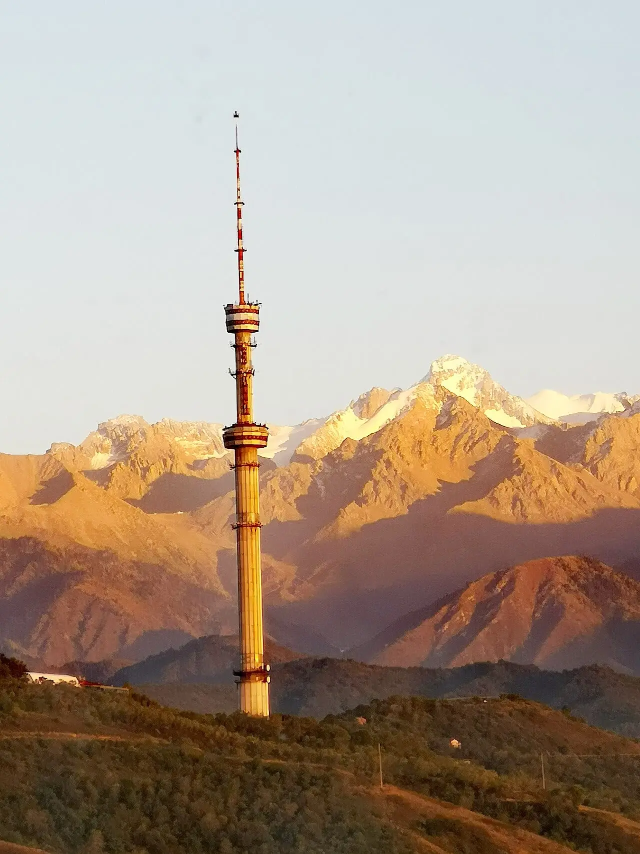 The Almaty TV tower against the Tian Shan mountains