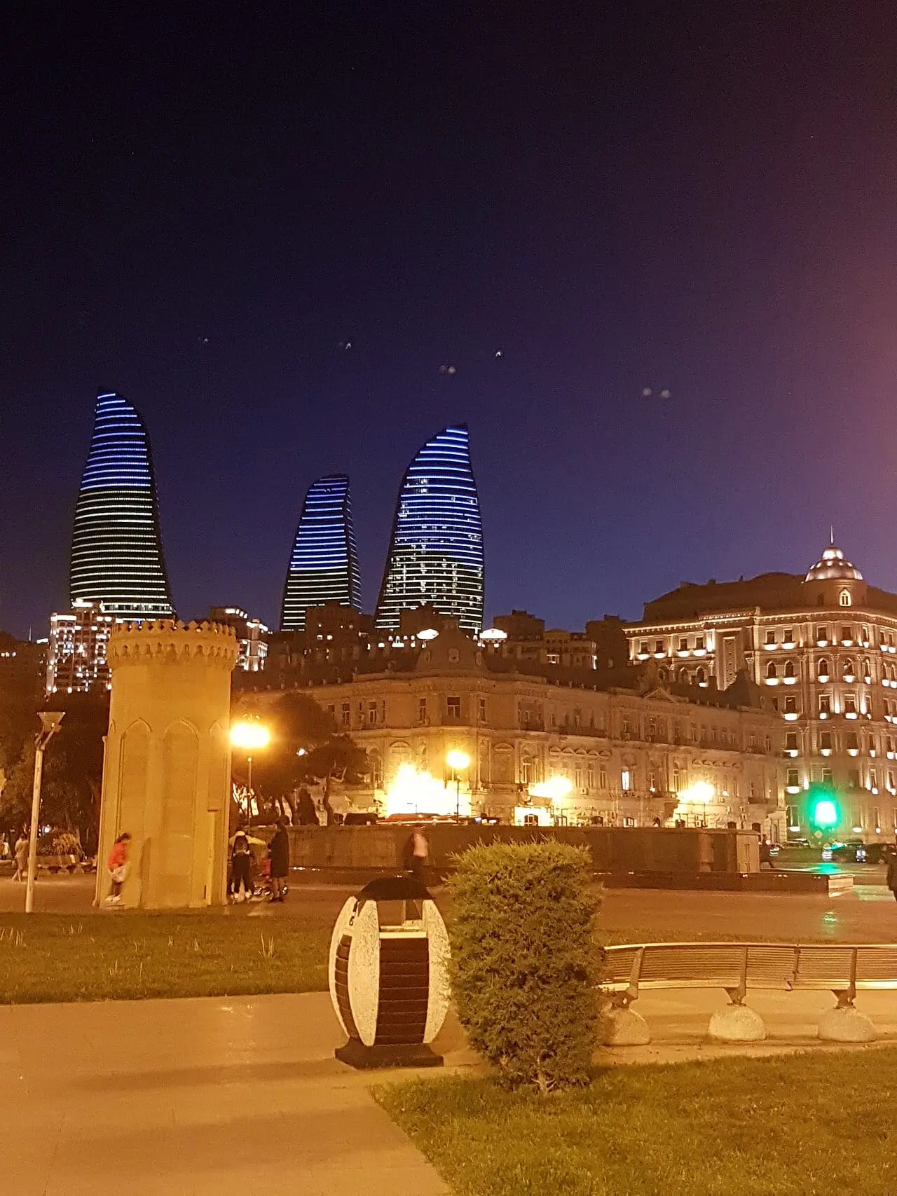 The Flame Towers rising behind old Baku