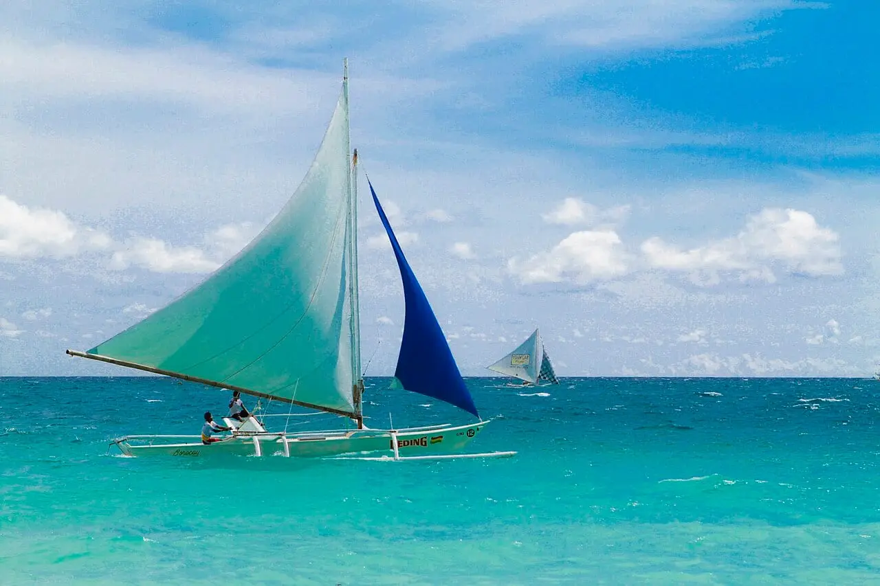 Paraw sailboats on Boracay's turquoise water