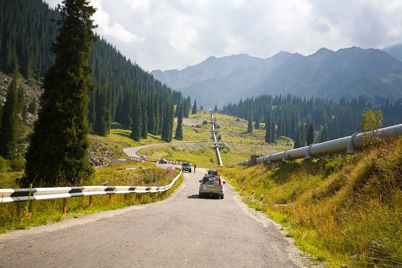 A road through the spruce forest of Ile-Alatau National Park