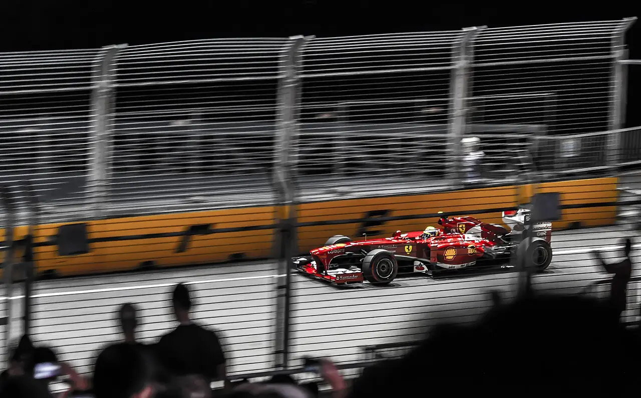 A Formula 1 car racing under the floodlights at the Singapore night race