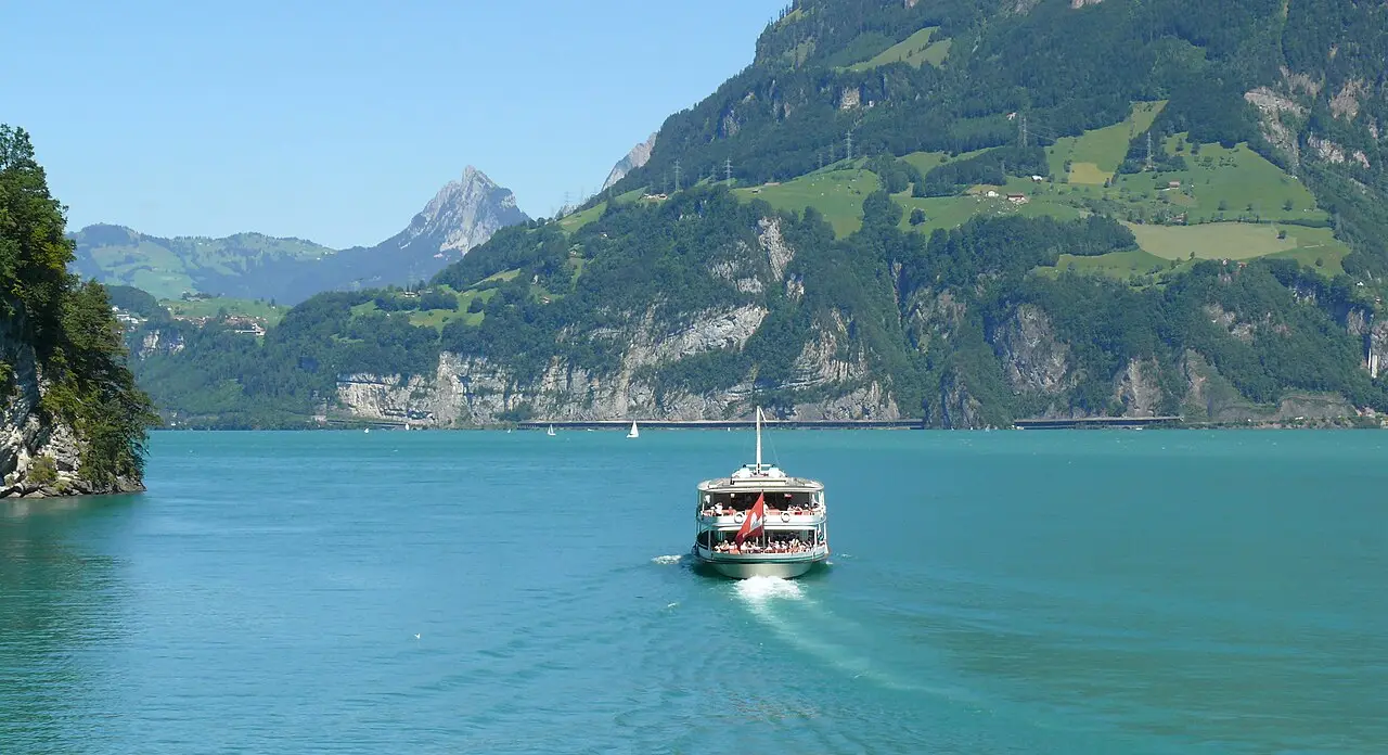 A boat crossing Lake Lucerne between the mountains