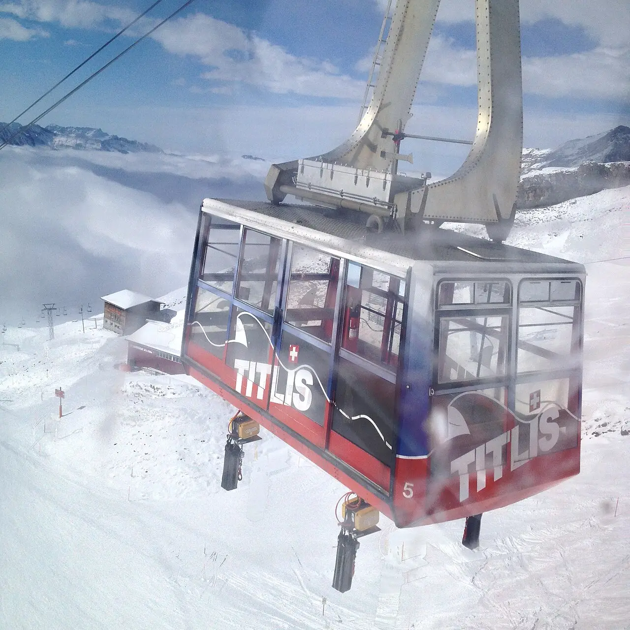 The red Titlis cable car above the snow