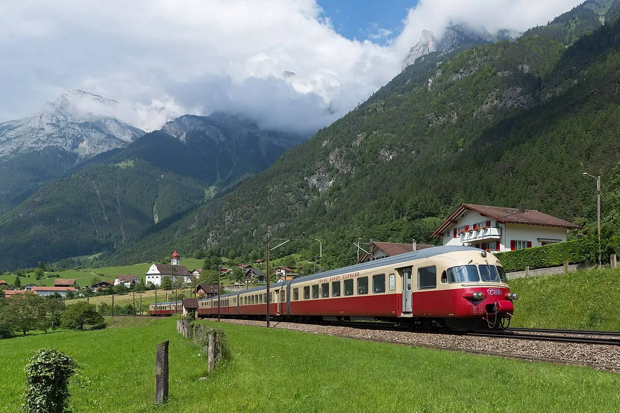 A red train in the mountains