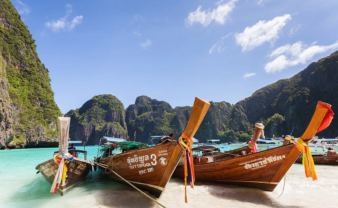 Longtail boats on the turquoise water of Maya Bay, Phi Phi