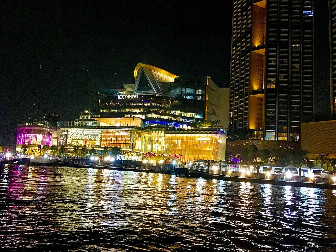 ICONSIAM lit up on the riverfront, where the cruise boards