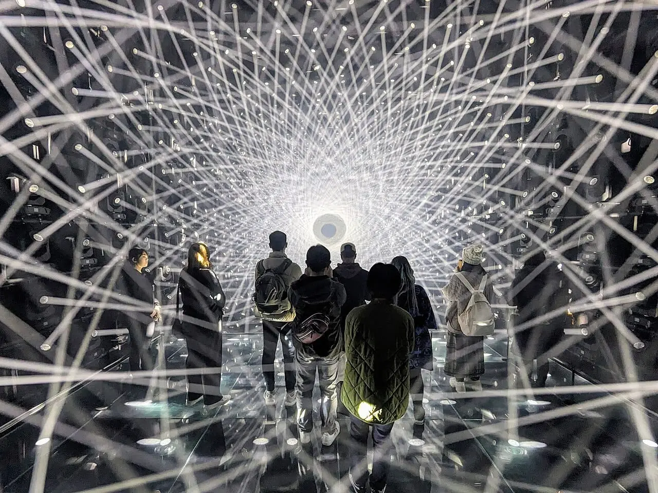 Visitors in a tunnel of light