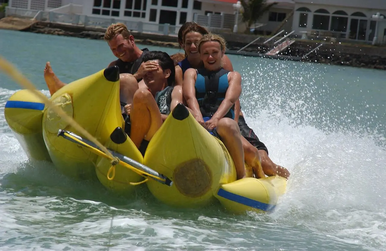 A banana boat being towed at speed