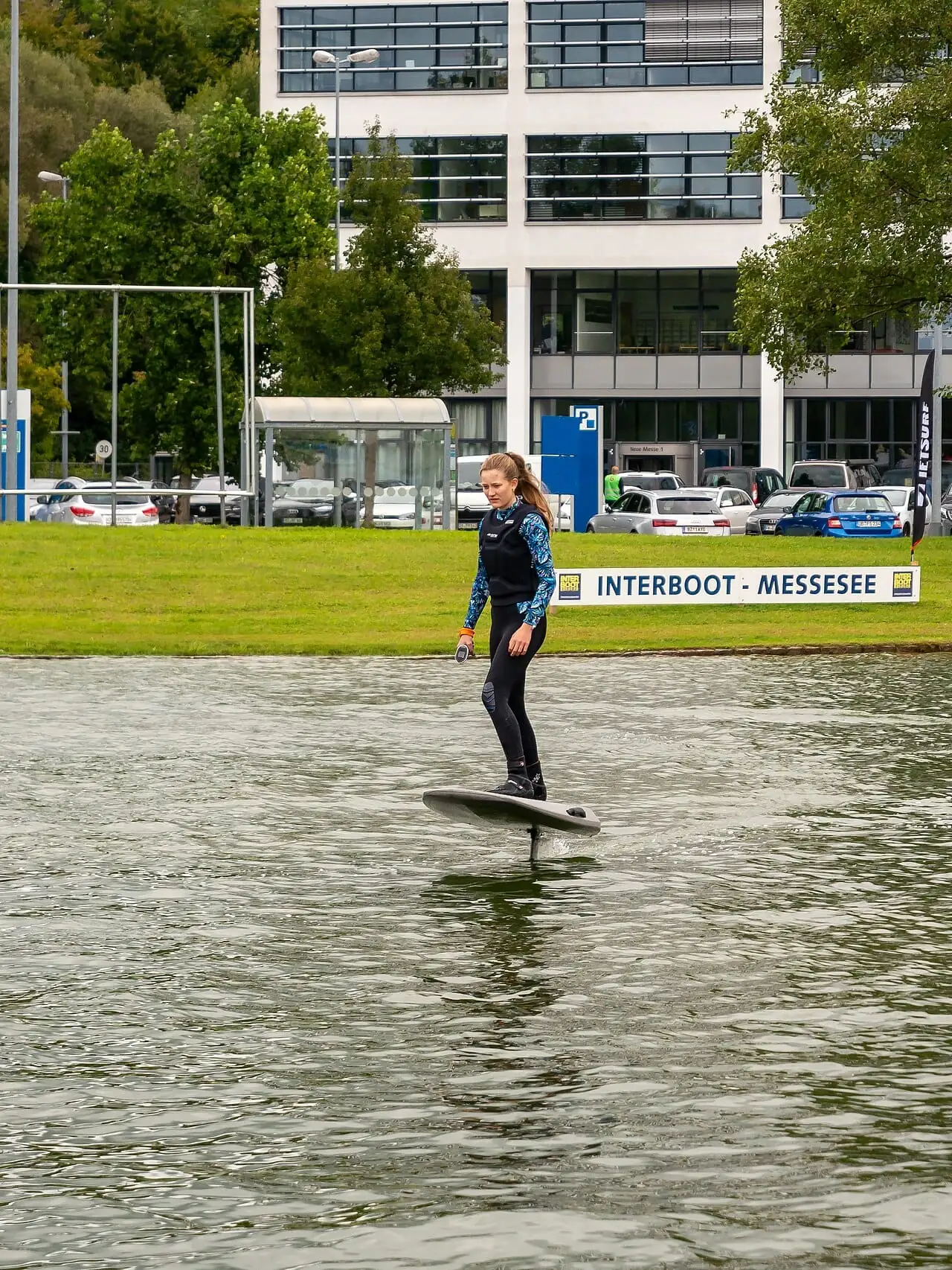 A rider standing on an eFoil board