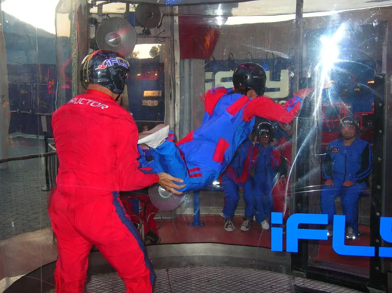Indoor skydiving in a glass tunnel