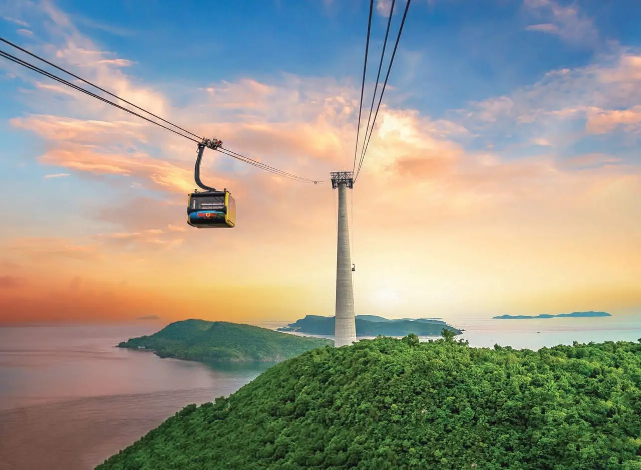 The Hon Thom cable car crossing to the islands at sunset