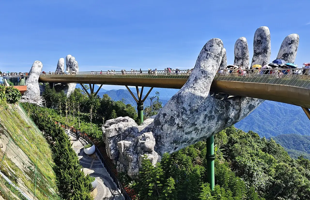 The Golden Bridge held up by giant stone hands at Ba Na Hills