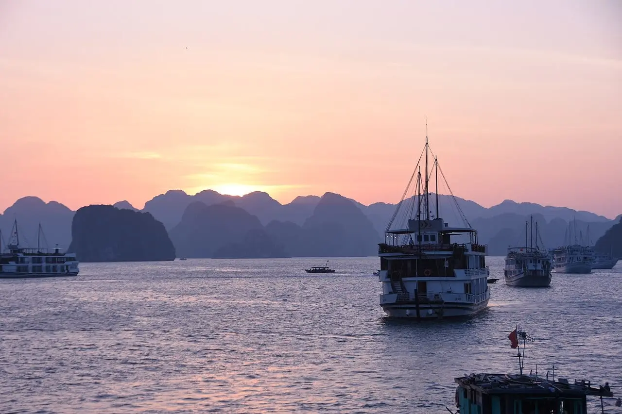 Cruise boats at sunset on Ha Long Bay