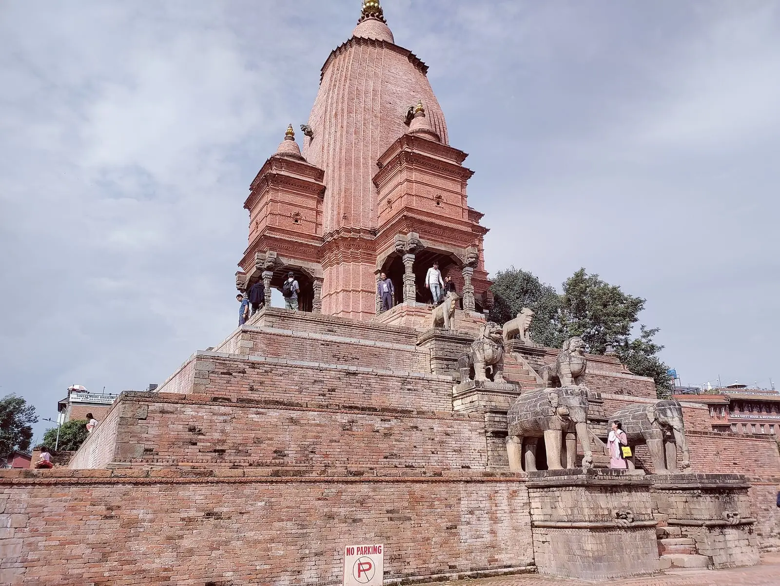 A stone temple and guardian statues in Bhaktapur Durbar Square