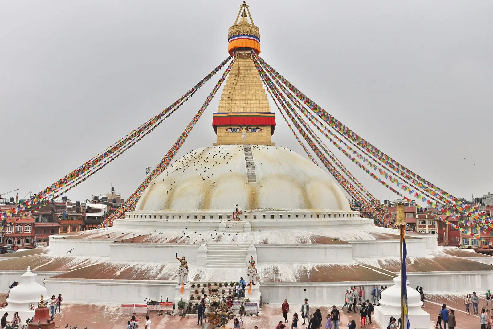Boudhanath Stupa with prayer flags against the sky
