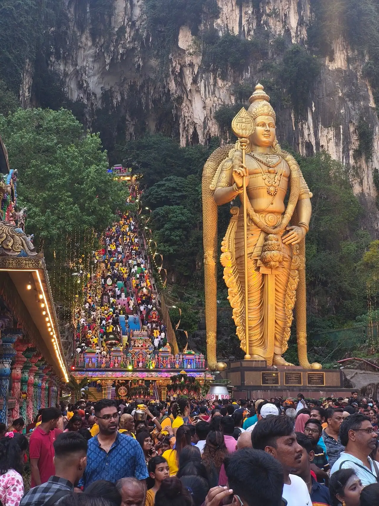 The golden Murugan statue and rainbow steps at Batu Caves