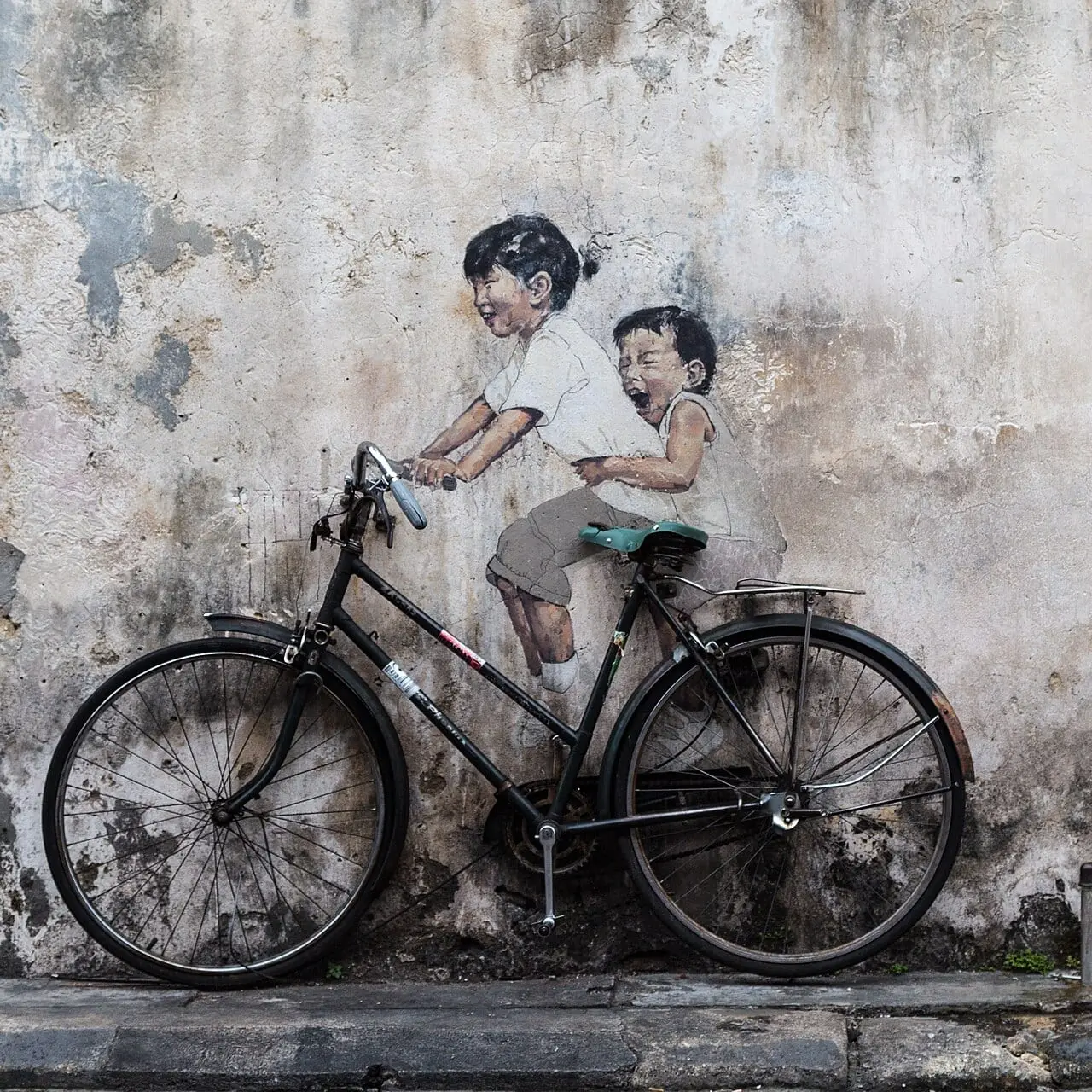 The famous children-on-a-bicycle street art in George Town, Penang