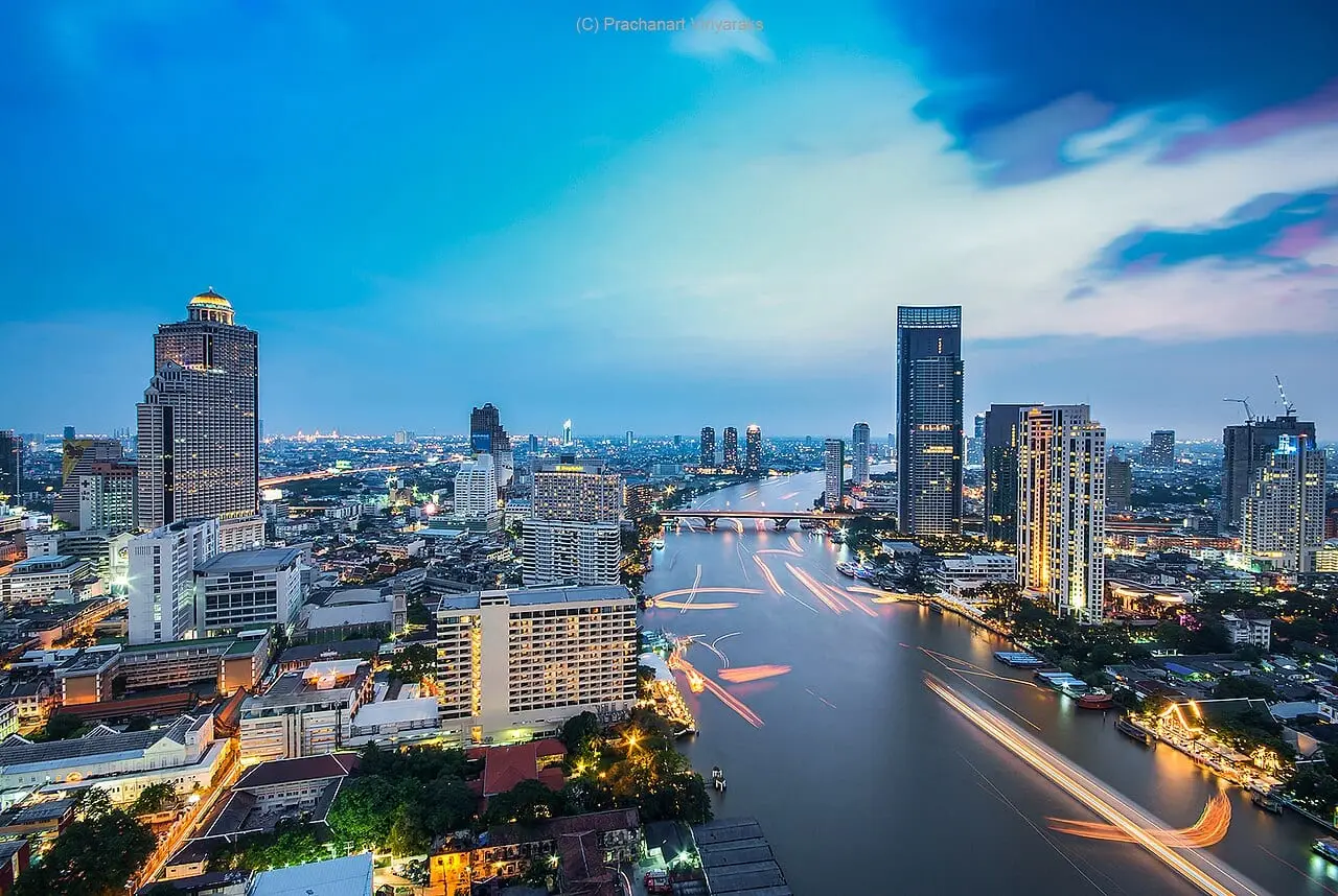 The Chao Phraya River winding through Bangkok at dusk