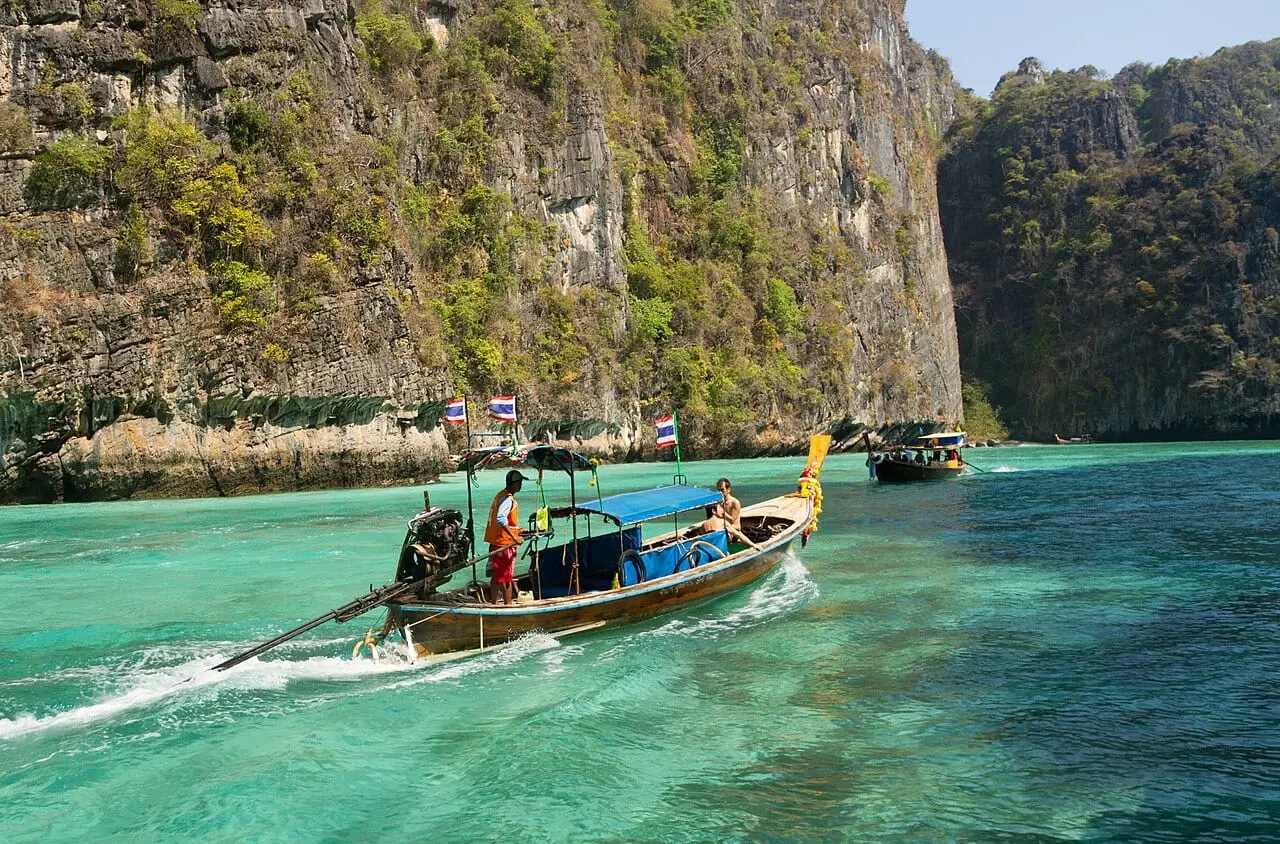 A longtail boat in the turquoise water of the Phi Phi Islands