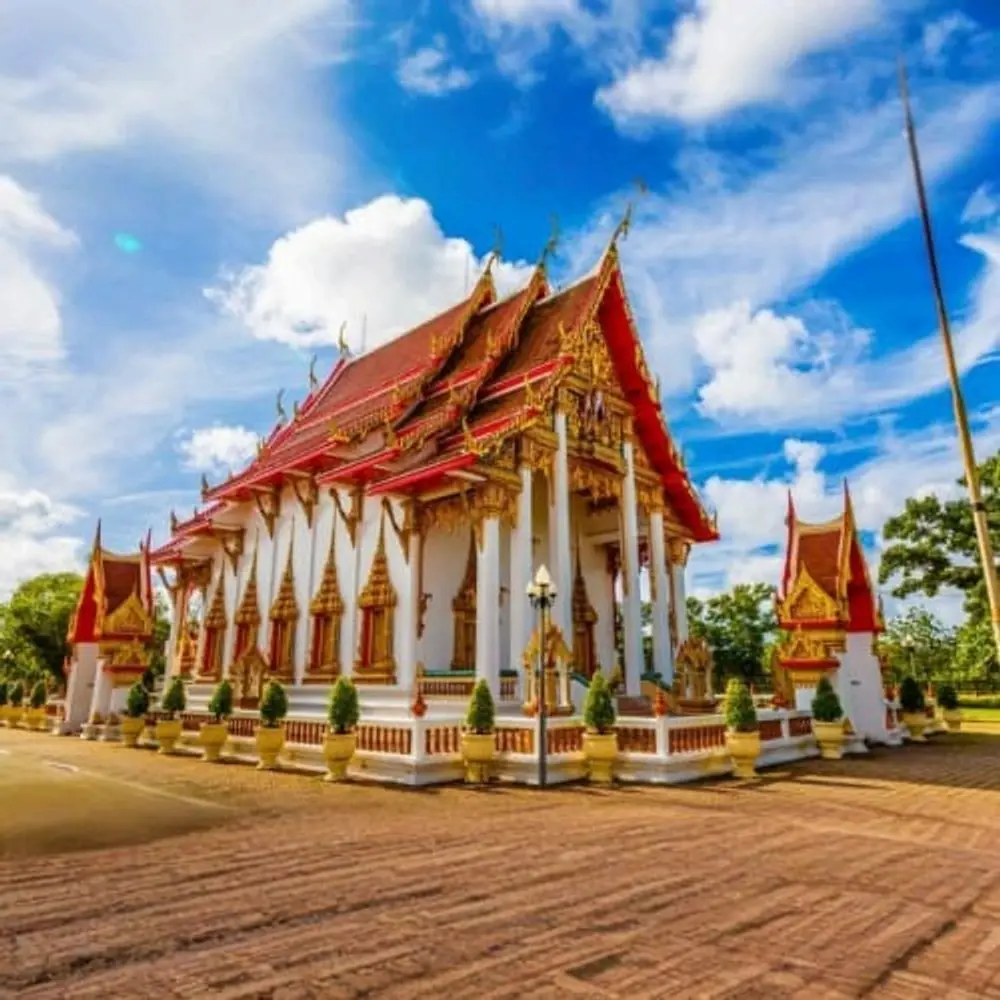The ornate red and gold roofs of a temple in Phuket